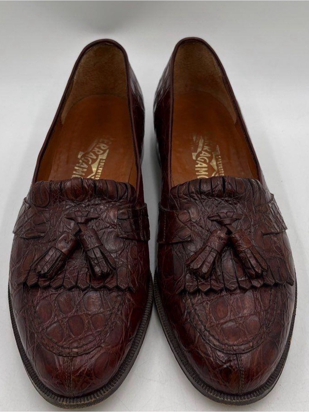 Salvatore Ferragamo Brown Crocodile
Kiltie Tassel Loafers COA